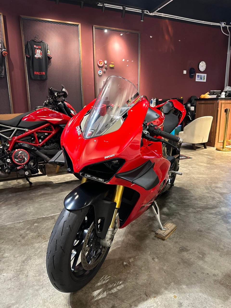 Red Panigale V4 S in the showroom, front three-quarter view